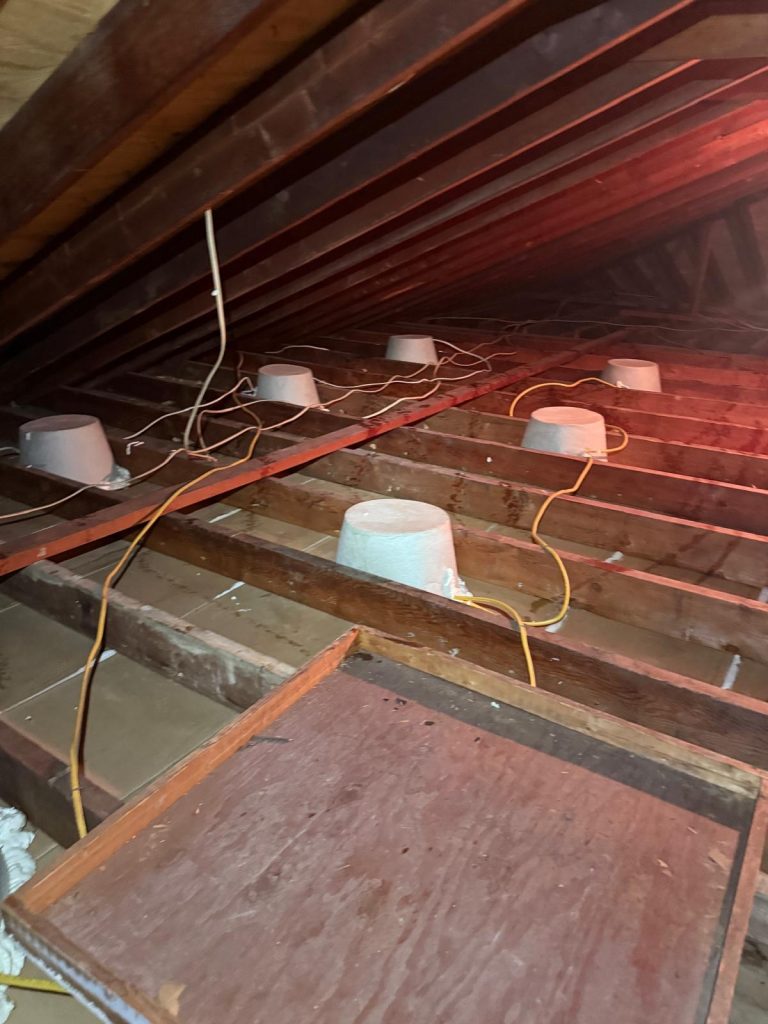 Attic light cover installation before new insulation in Essex County, NJ